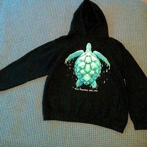 Black sweatshirt with blue/green turtle